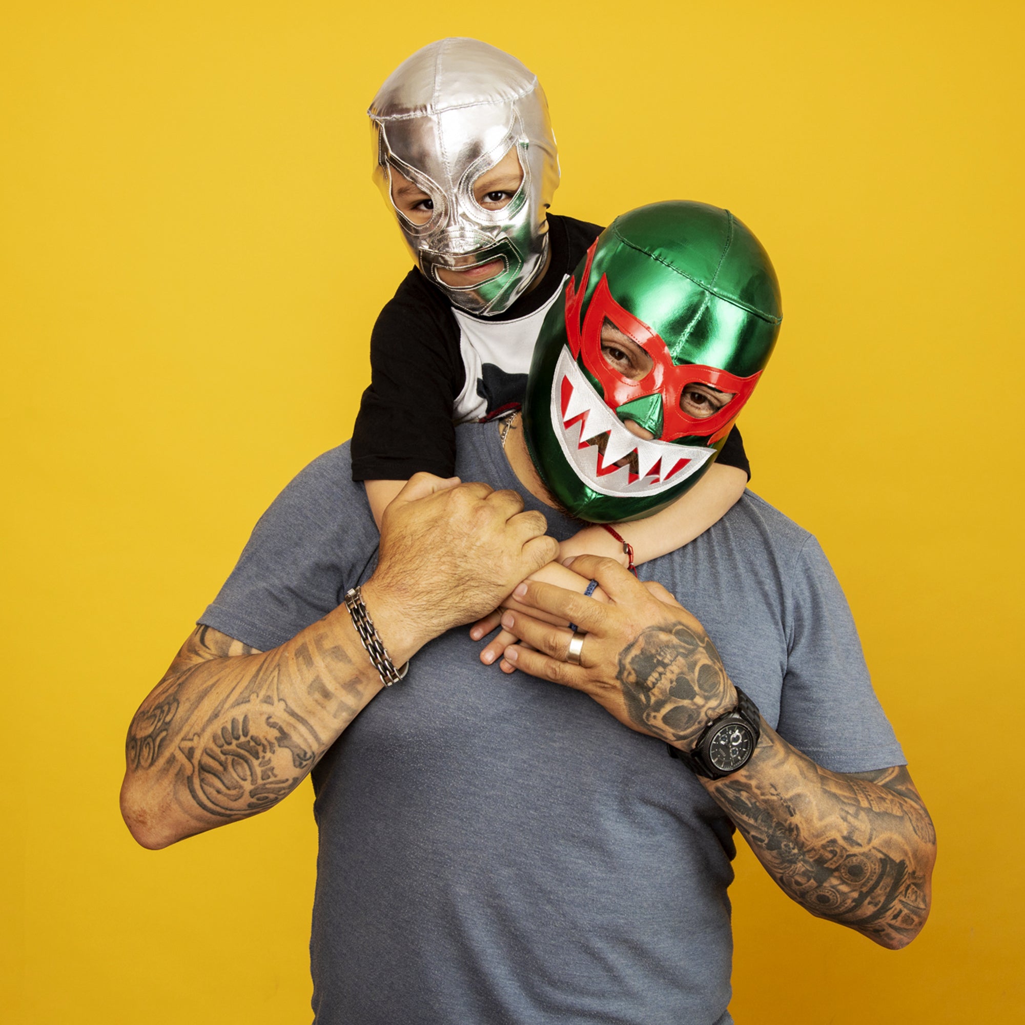 Father & Son Wearing Lucha Libre Masks